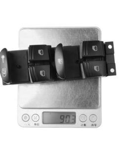 A set of black buttons on a Porsche Cayenne (2007-2010) 95561315602 control window switch.